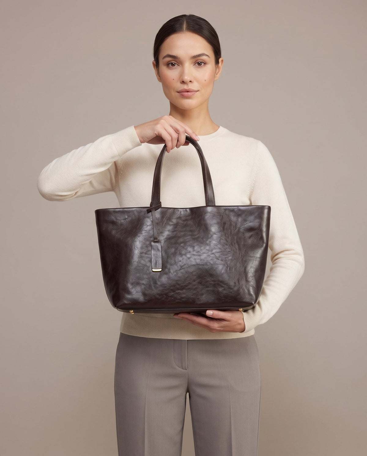 Aubrine Albertine Tote in Dark Brown, held