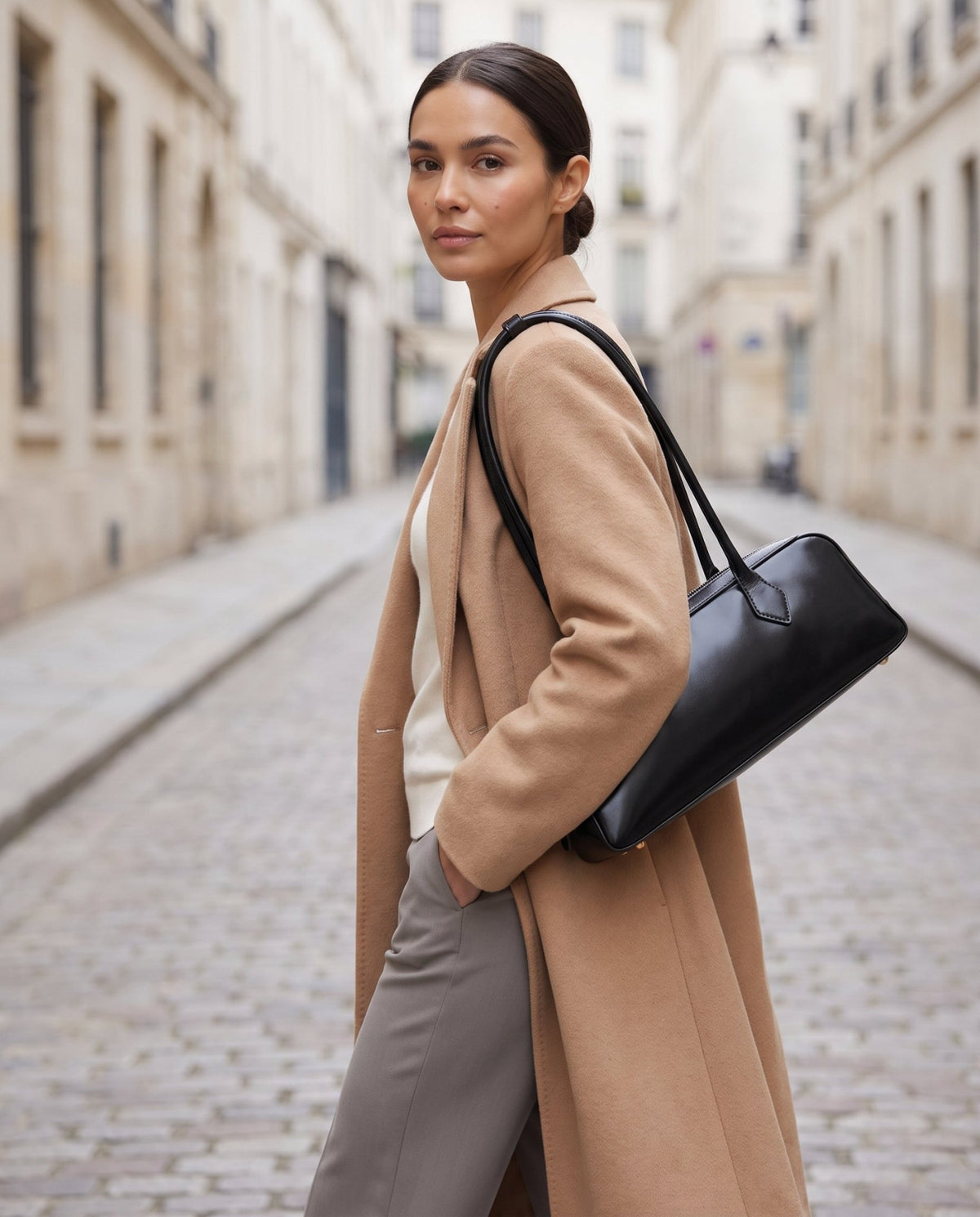 Aubrine Anouk Baguette Bag in Black, worn on the shoulder