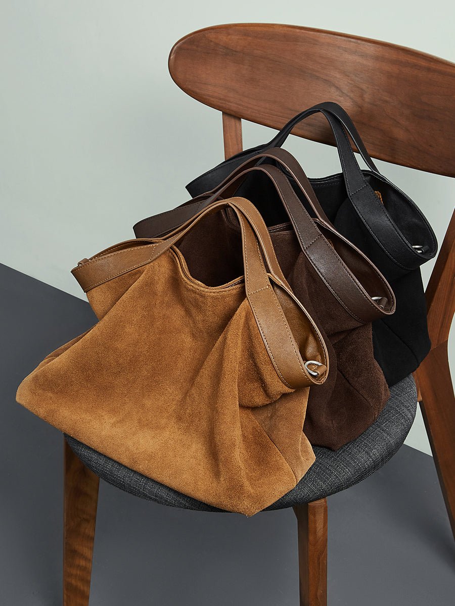 Aubrine Cecile Suede Tote in Black, worn on the shoulder