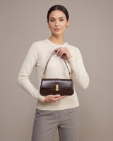 Aubrine Constance Baguette Bag in Black, held