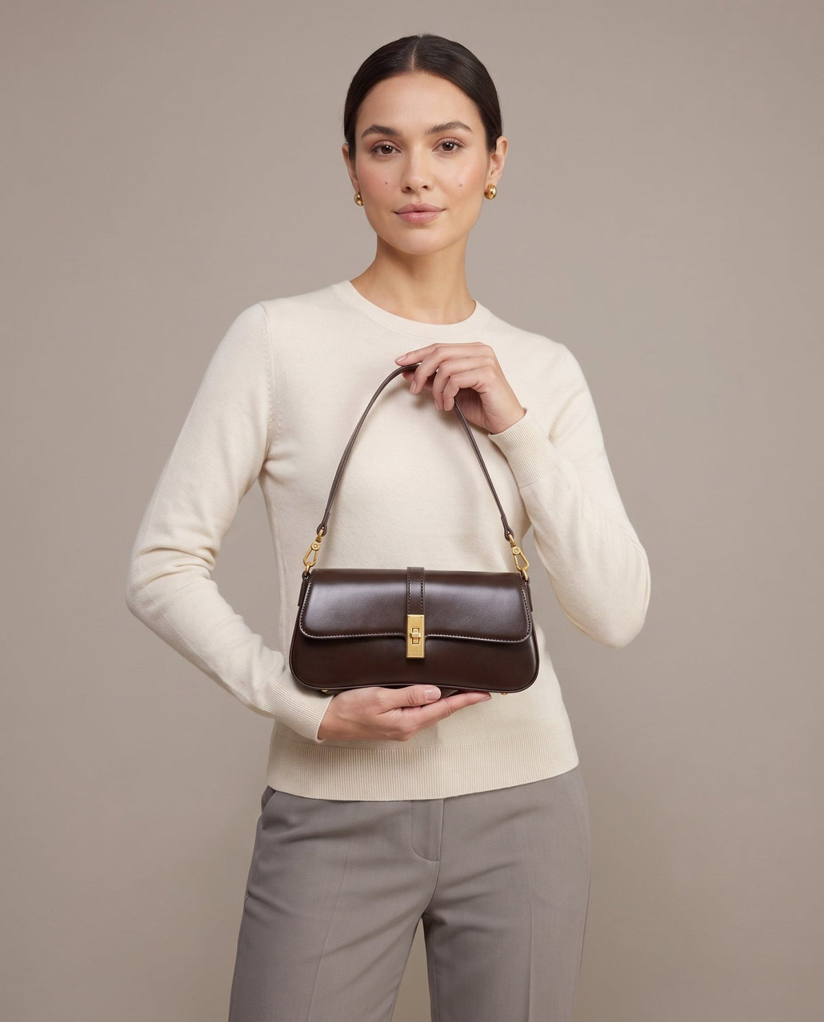 Aubrine Constance Baguette Bag in Black, held