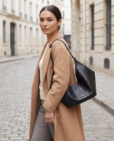 Aubrine Eliane Woven Bag in Black, worn on the shoulder